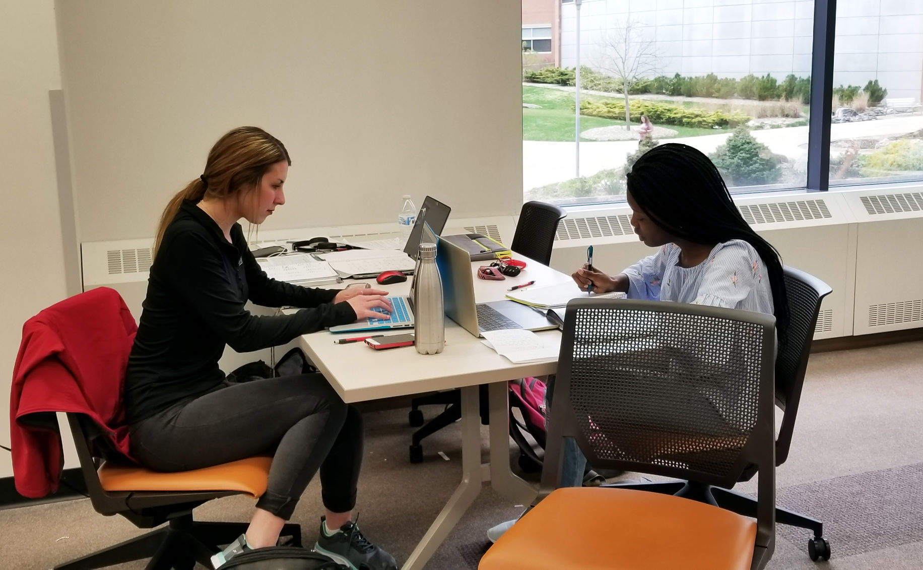 Kaela Wunderlich and Kyra Barnes study in the Waldo Library